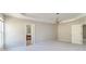 Bright main bedroom with an ensuite bath, ample natural light, and neutral paint at 2848 Stockbridge Way, Dacula, GA 30019