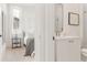 Bathroom featuring sleek fixtures, modern design, and a frameless shower adjacent to the bedroom at 370 2Nd St, Fayetteville, GA 30214
