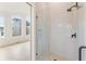 Modern bathroom featuring a glass shower with matte black fixtures and bright, stylish white tiles at 370 2Nd St, Fayetteville, GA 30214