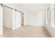 Bright and open primary bedroom with sliding barn door and lots of natural light at 370 2Nd St, Fayetteville, GA 30214