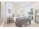 Bright bedroom with large windows, neutral decor, and hardwood floors at 370 2Nd St, Fayetteville, GA 30214