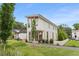 Modern two-story home with clean lines, complemented by landscaped front yard and gravel walkway at 370 2Nd St, Fayetteville, GA 30214