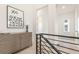 Upstairs hallway featuring a custom chest of drawers, rail, and a light and bright aesthetic at 370 2Nd St, Fayetteville, GA 30214