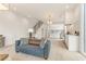 Bright living room with modern furnishings, open to kitchen and stairs, flooded with natural light at 370 2Nd St, Fayetteville, GA 30214