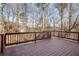 Back deck boasts wood railings and ample space to enjoy the view and fresh air at 5114 Parkwood Oaks Ln, Mableton, GA 30126