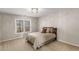 Neutral-toned bedroom with wall to wall carpeting, queen bed, and a large sunny window at 5114 Parkwood Oaks Ln, Mableton, GA 30126