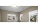 Bright bedroom with three windows adorned with roman shades provides ample natural light and privacy at 5114 Parkwood Oaks Ln, Mableton, GA 30126