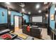 Luxurious home theater with comfortable seating and a large screen for the ultimate movie-watching experience at 5114 Parkwood Oaks Ln, Mableton, GA 30126