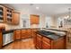Gourmet kitchen with stainless steel appliances, granite countertops, and a central island cooktop at 5114 Parkwood Oaks Ln, Mableton, GA 30126