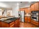 Open kitchen featuring stainless appliances, wooden cabinets, and granite countertops at 5114 Parkwood Oaks Ln, Mableton, GA 30126