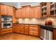 Kitchen with stainless steel appliances, wooden cabinets, and granite countertops at 5114 Parkwood Oaks Ln, Mableton, GA 30126