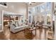 Bright living room with soaring windows, fireplace, and open access to the gourmet kitchen at 5114 Parkwood Oaks Ln, Mableton, GA 30126