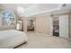 Spacious main bedroom features an arch window, neutral color palette, and leads to en suite bathroom at 5114 Parkwood Oaks Ln, Mableton, GA 30126