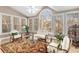 Bright sunroom featuring neutral walls, lots of windows and natural lighting, ceiling fan and ornate seating arrangements at 5114 Parkwood Oaks Ln, Mableton, GA 30126
