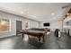 Spacious basement featuring a pool table, wet bar, and comfortable seating area for entertaining at 1830 Marietta Nw Rd, Atlanta, GA 30318
