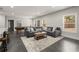 Open basement layout featuring a large sectional sofa, and wet bar, perfect for entertaining at 1830 Marietta Nw Rd, Atlanta, GA 30318