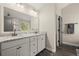 Bathroom featuring dual sinks with granite countertops and a large mirror at 1830 Marietta Nw Rd, Atlanta, GA 30318