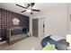 bedroom features a patterned wallpaper, plush carpeting, and a ceiling fan at 1830 Marietta Nw Rd, Atlanta, GA 30318
