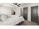 Bright bedroom with plush carpeting, ceiling fan and gray doors and trim at 1830 Marietta Nw Rd, Atlanta, GA 30318