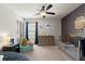 Cozy bedroom with stylish wallpaper, modern ceiling fan, and neutral carpeting at 1830 Marietta Nw Rd, Atlanta, GA 30318