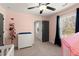 Bright Bedroom featuring a play tent, and a window with dark blue curtains at 1830 Marietta Nw Rd, Atlanta, GA 30318