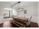 Spacious dining room with a large wooden table and a modern chandelier, perfect for gatherings at 1830 Marietta Nw Rd, Atlanta, GA 30318