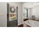 Bright entryway with a front door with window blinds, leading into a cozy seating area at 1830 Marietta Nw Rd, Atlanta, GA 30318