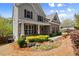 Charming home with a welcoming covered porch and professionally designed landscaping at 1830 Marietta Nw Rd, Atlanta, GA 30318