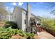 Charming two-story home boasts a large deck, lush greenery, and a private backyard with stairs leading down at 1830 Marietta Nw Rd, Atlanta, GA 30318