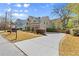 Beautifully landscaped property featuring a long driveway and lush greenery at 1830 Marietta Nw Rd, Atlanta, GA 30318