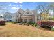 Charming two-story home with a well-manicured lawn and beautiful landscaping at 1830 Marietta Nw Rd, Atlanta, GA 30318