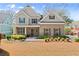 Inviting home with brick facade, covered porch, and professionally landscaped front yard at 1830 Marietta Nw Rd, Atlanta, GA 30318