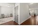Inviting hallway showcasing dark hardwood flooring and neutral walls connecting the living spaces at 1830 Marietta Nw Rd, Atlanta, GA 30318