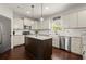 Elegant kitchen with granite countertops, stainless steel appliances, and a dark kitchen island at 1830 Marietta Nw Rd, Atlanta, GA 30318
