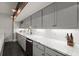Basement wet bar with white subway tile backsplash and marble countertops at 1830 Marietta Nw Rd, Atlanta, GA 30318