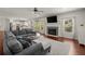 Spacious living room with fireplace, hardwood floors, bright light, and open concept kitchen at 1830 Marietta Nw Rd, Atlanta, GA 30318