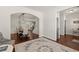 Open-concept living room featuring hardwood floors and an archway leading to the dining area at 1830 Marietta Nw Rd, Atlanta, GA 30318