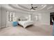 Spacious main bedroom features a tray ceiling, a ceiling fan, and large windows with ample natural light at 1830 Marietta Nw Rd, Atlanta, GA 30318