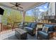 Relaxing covered patio featuring comfortable seating, ceiling fan, and outdoor space at 1830 Marietta Nw Rd, Atlanta, GA 30318