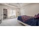 Spacious bedroom with bright natural light and carpet flooring at 210 Little River Farms Trl, Canton, GA 30115