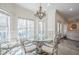 Cozy breakfast nook with bay window, chandelier, and hardwood floors at 210 Little River Farms Trl, Canton, GA 30115
