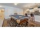 Recreation space with a kitchen and pool table perfect for entertaining guests at 210 Little River Farms Trl, Canton, GA 30115