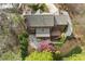 Aerial view of a home with an outdoor patio and deck overlooking the mature landscaped yard at 2702 Long Lake Ne Ter, Roswell, GA 30075