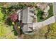 Aerial view of the home's roof, patio and extensive back yard landscaping and mature tree coverage at 2702 Long Lake Ne Ter, Roswell, GA 30075