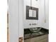 A modern bathroom with a vessel sink and a decorative mirror at 2702 Long Lake Ne Ter, Roswell, GA 30075