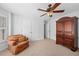 Cozy bedroom with seating area and large closet space provides ample storage and a relaxing atmosphere at 2702 Long Lake Ne Ter, Roswell, GA 30075