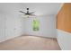 This bedroom features carpet floors, a ceiling fan, a window and a large closet at 2702 Long Lake Ne Ter, Roswell, GA 30075
