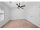 This bedroom has carpet floors, a ceiling fan and a large closet at 2702 Long Lake Ne Ter, Roswell, GA 30075