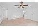 This bedroom has carpet floors, a ceiling fan and access to the hallway and closet at 2702 Long Lake Ne Ter, Roswell, GA 30075