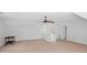 A bonus room with carpet floors, a window and a ceiling fan at 2702 Long Lake Ne Ter, Roswell, GA 30075
